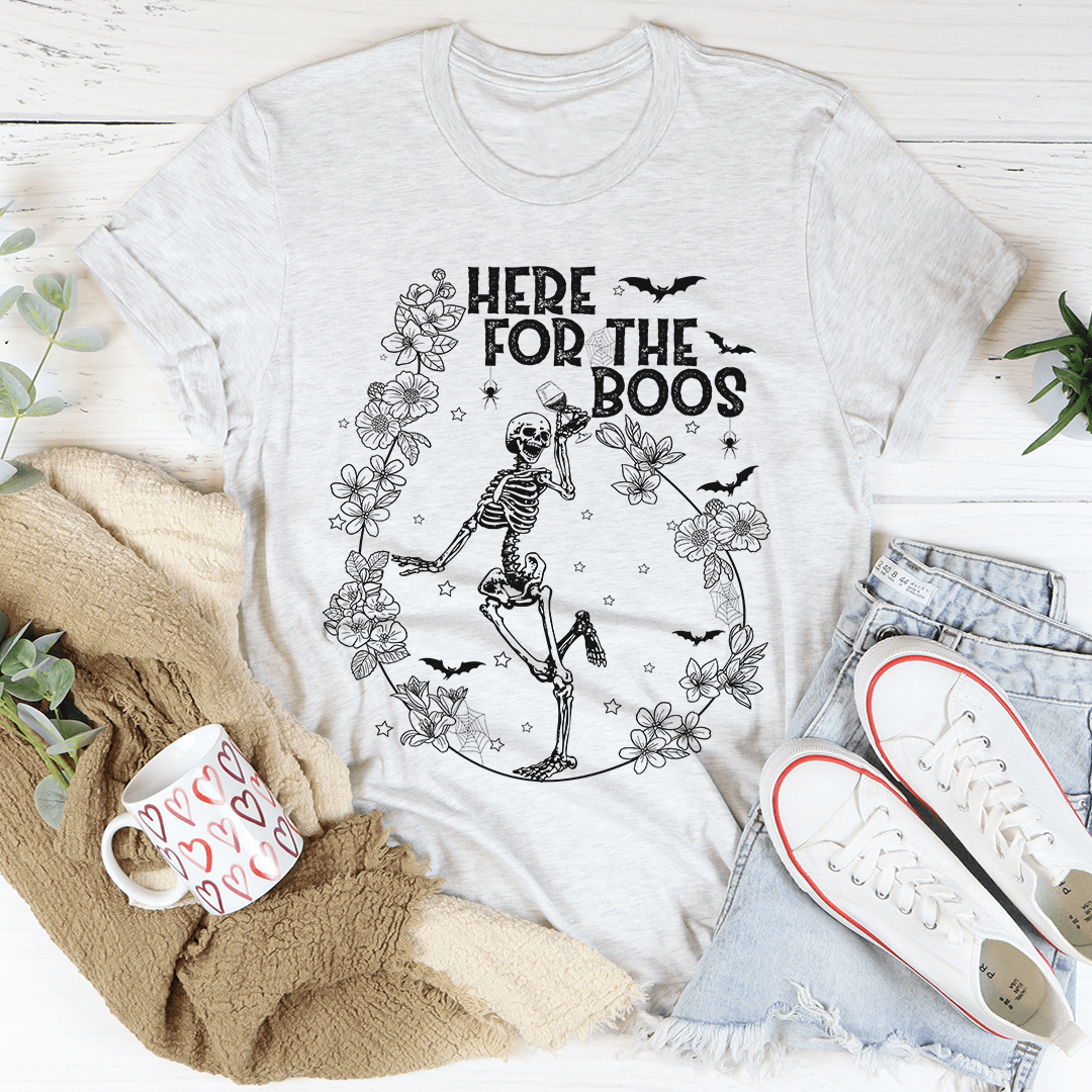 Here For The Boos Wine Tee featuring a playful wine-themed design on a soft cotton fabric.