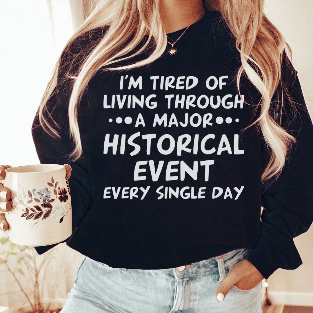 A cozy Historical Event sweatshirt featuring unique designs by various artists, showcasing a cotton/poly fleece blend for warmth.