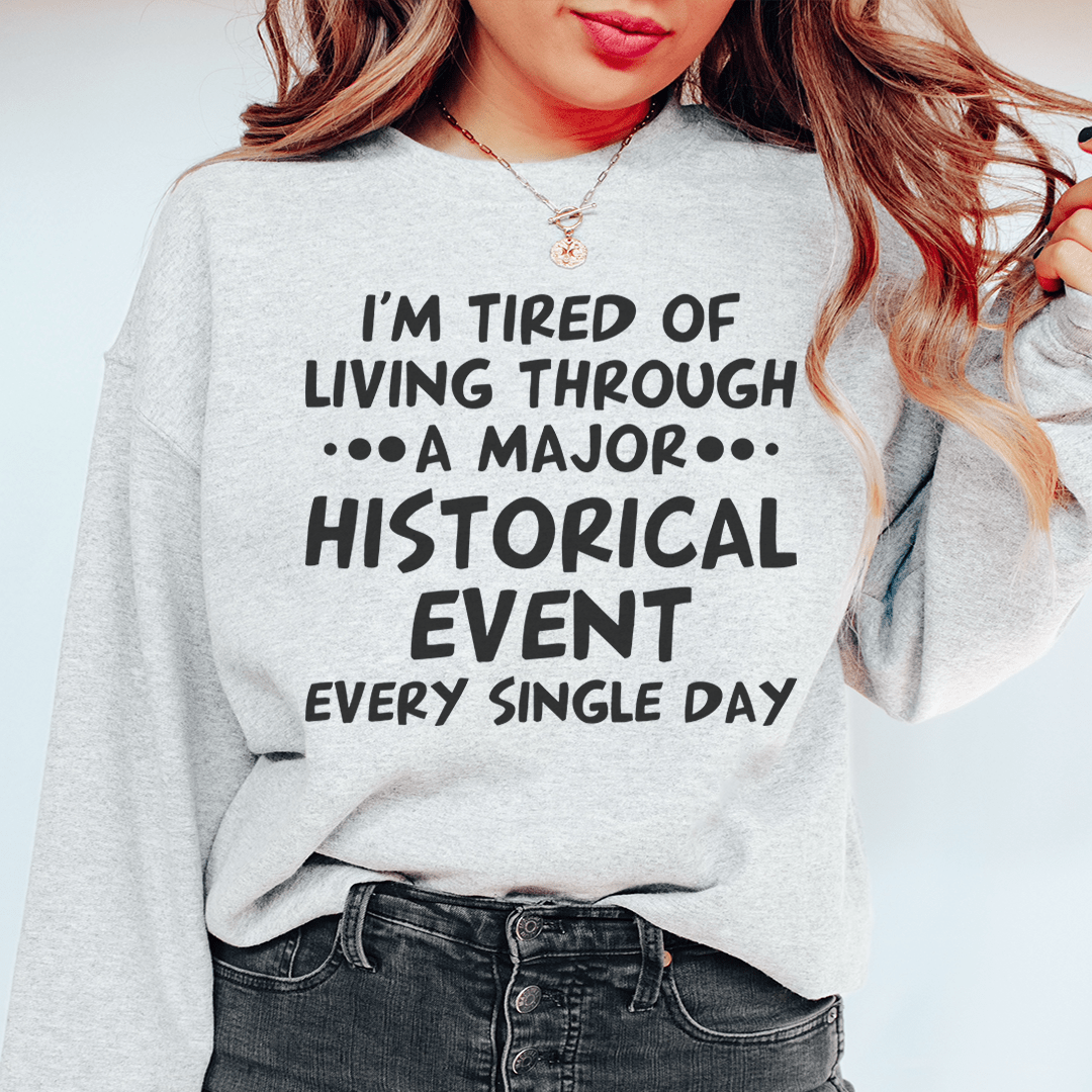 A cozy Historical Event sweatshirt featuring unique designs by various artists, showcasing a cotton/poly fleece blend for warmth.