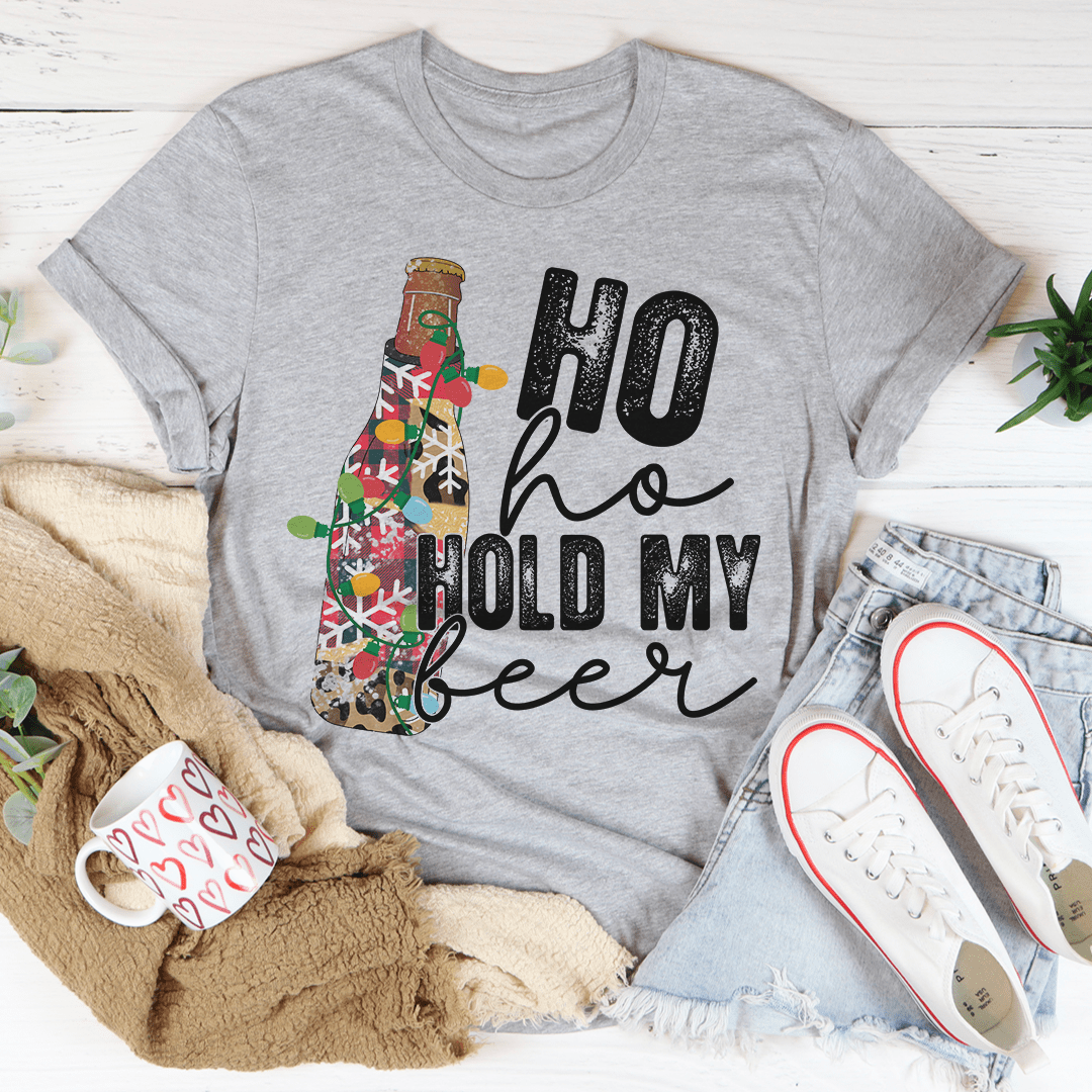 Ho Ho Hold My Beer T-Shirt in various colors, showcasing its soft cotton fabric and durable stitching.