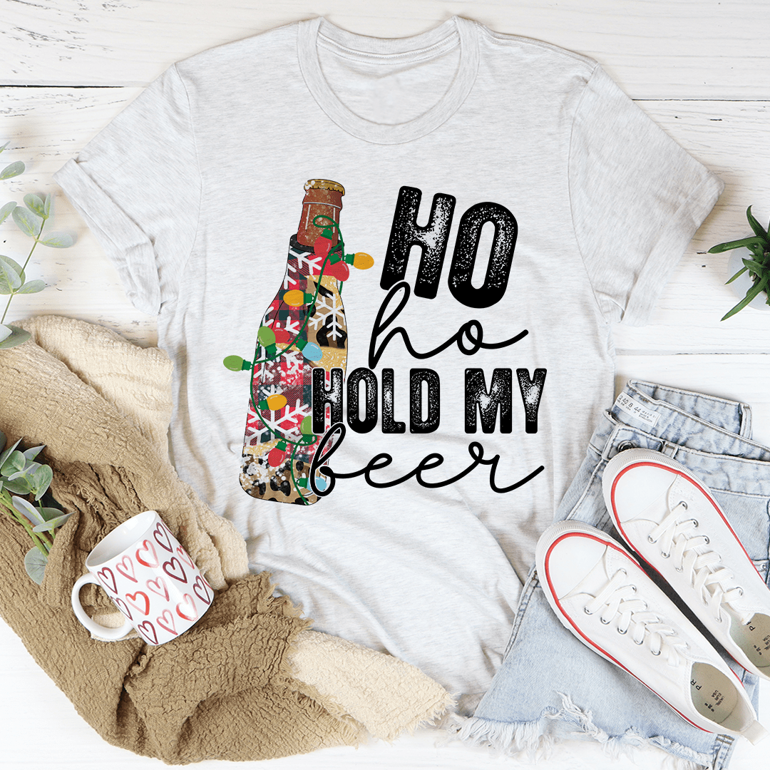 Ho Ho Hold My Beer T-Shirt in various colors, showcasing its soft cotton fabric and durable stitching.