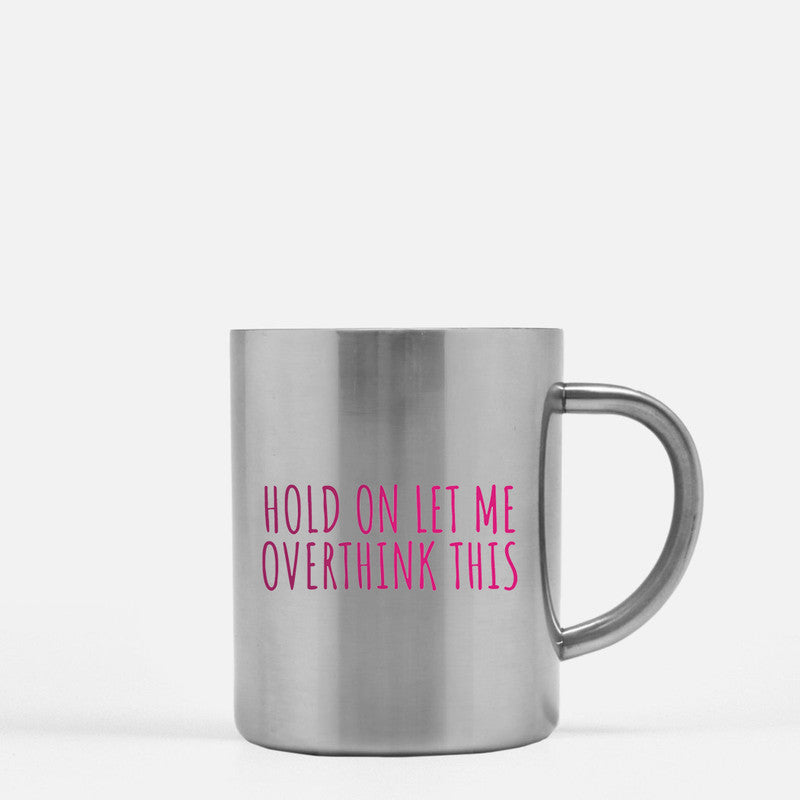 A stylish gold and silver ceramic mug with the phrase 'Hold On Let Me Overthink This' elegantly displayed.