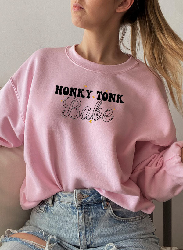 Honky Tonk Babe Sweat Shirt featuring a cozy fleece lining and adjustable cuffs, designed for comfort and style.