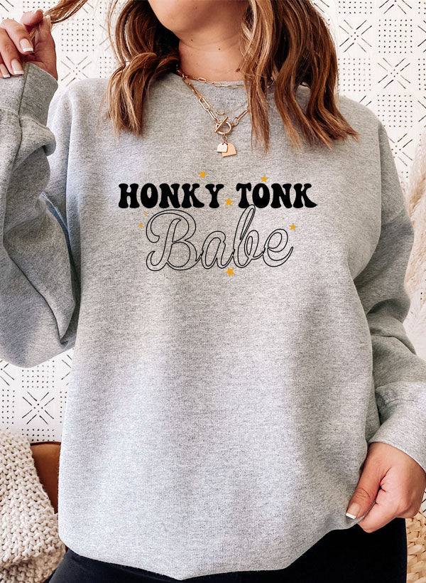 Honky Tonk Babe Sweat Shirt featuring a cozy fleece lining and adjustable cuffs, designed for comfort and style.