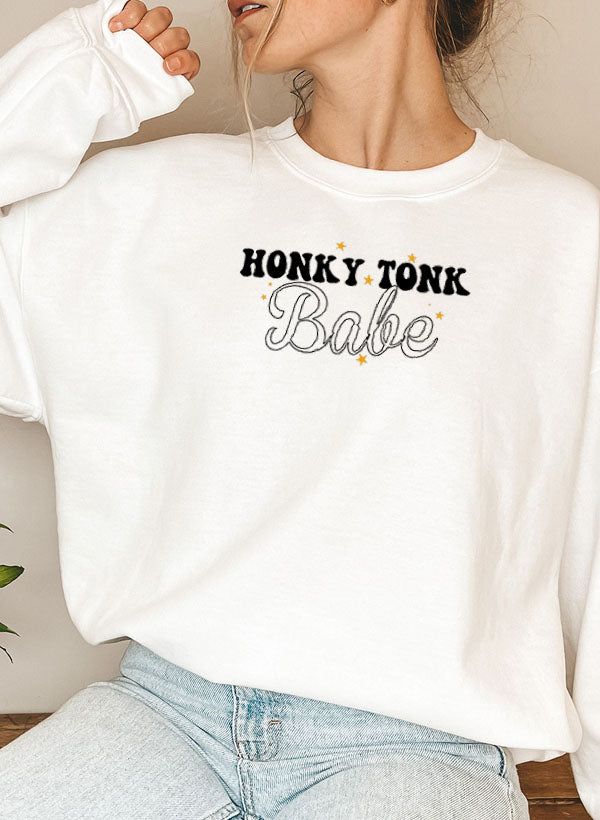 Honky Tonk Babe Sweat Shirt featuring a cozy fleece lining and adjustable cuffs, designed for comfort and style.