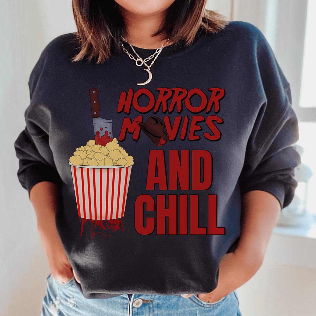 Cozy 'Horror Movies And Chill' sweats featuring unique horror-themed designs, made from a soft cotton/poly fleece blend.