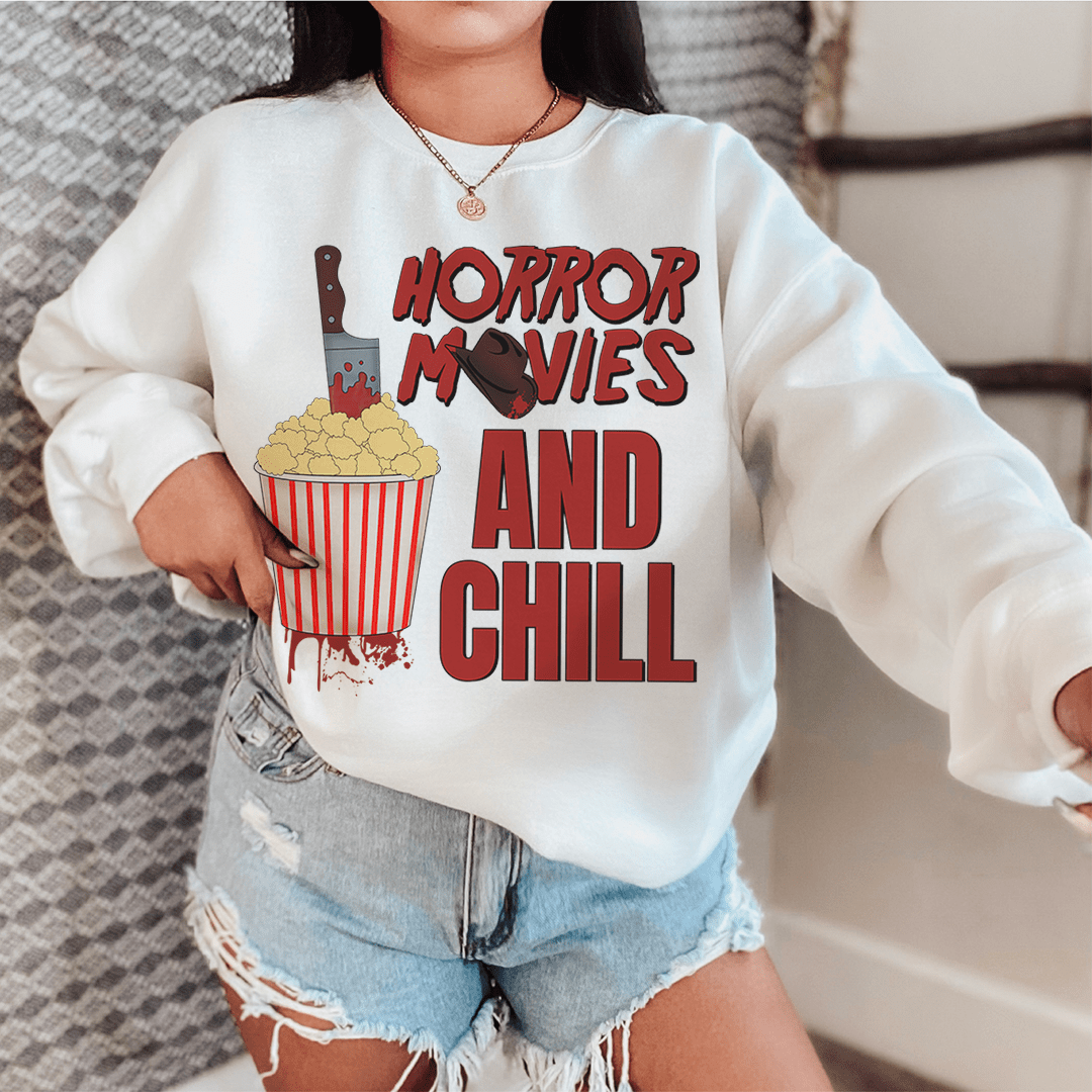 Cozy 'Horror Movies And Chill' sweats featuring unique horror-themed designs, made from a soft cotton/poly fleece blend.