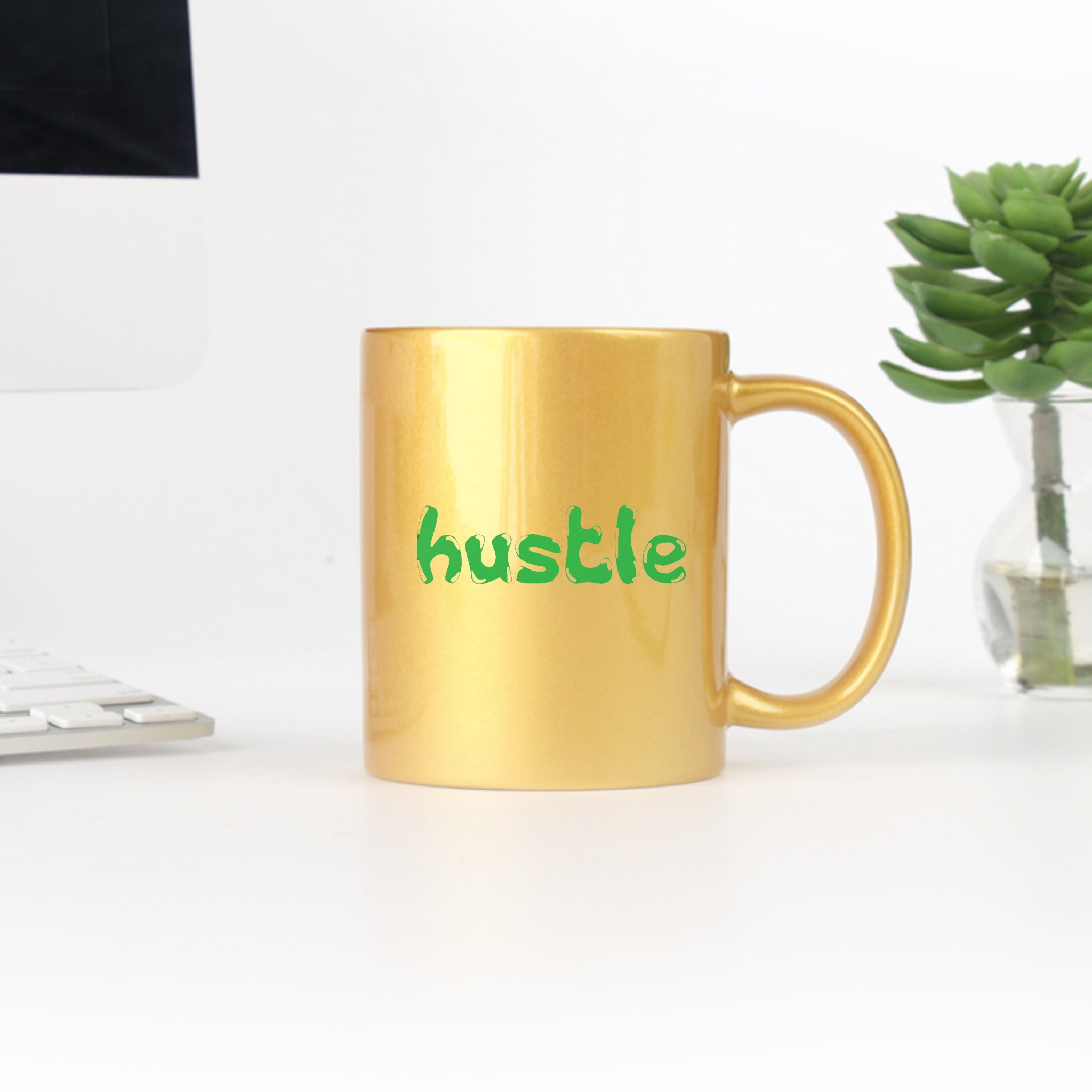 Hustle Gold & Silver Mug showcasing elegant design with gold metallic coating on ceramic material.