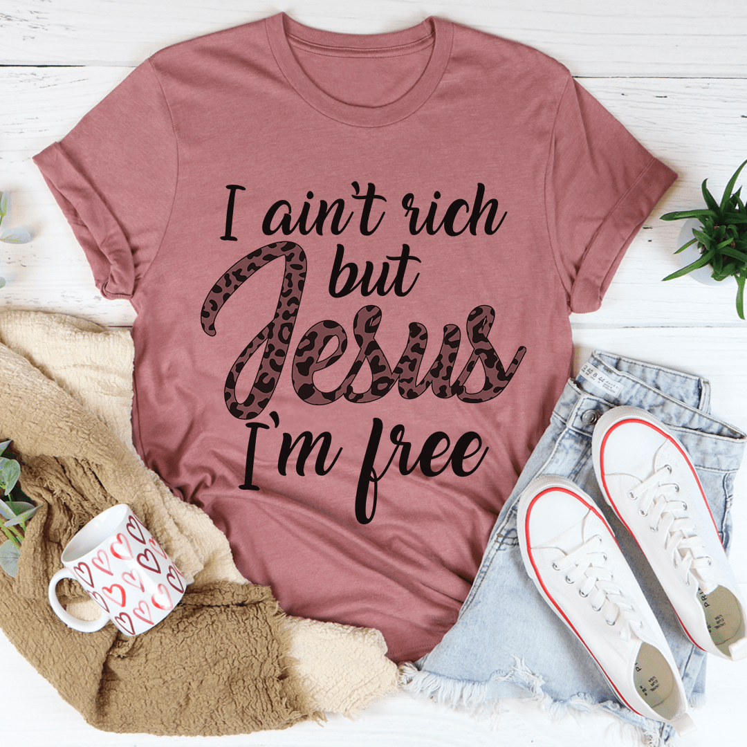 I Ain't Rich But Jesus I'm Free Tee, featuring a bold statement design on a soft, durable cotton fabric.