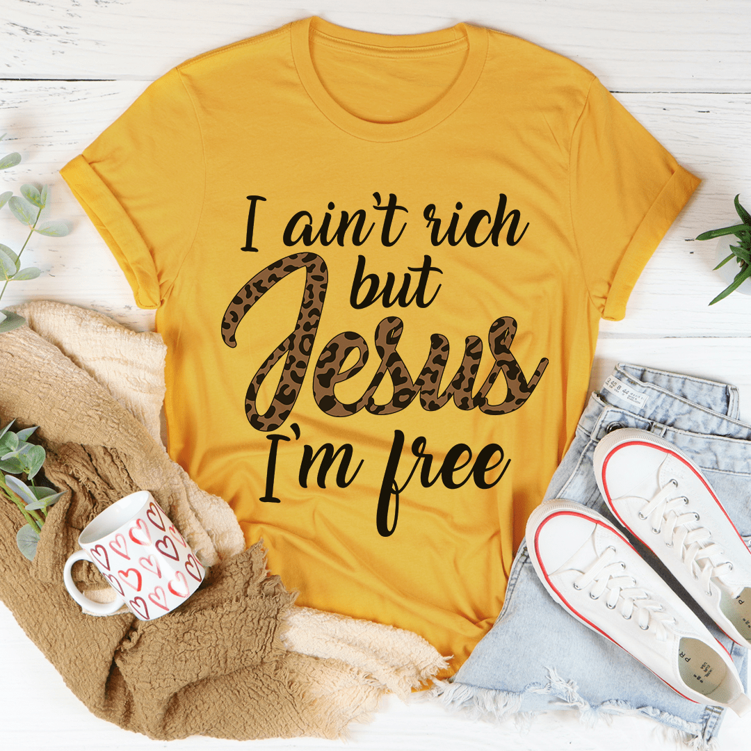 I Ain't Rich But Jesus I'm Free Tee, featuring a bold statement design on a soft, durable cotton fabric.