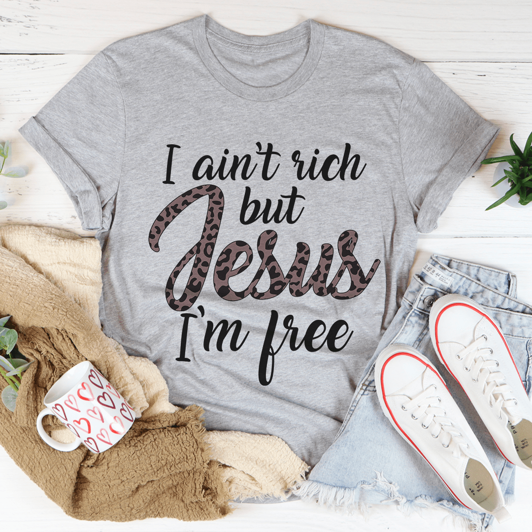 I Ain't Rich But Jesus I'm Free Tee, featuring a bold statement design on a soft, durable cotton fabric.