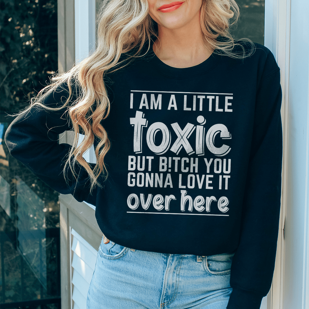 I Am A Little Toxic sweatshirt featuring a unique artistic design, made from a cozy cotton/poly fleece blend with adjustable cuffs.