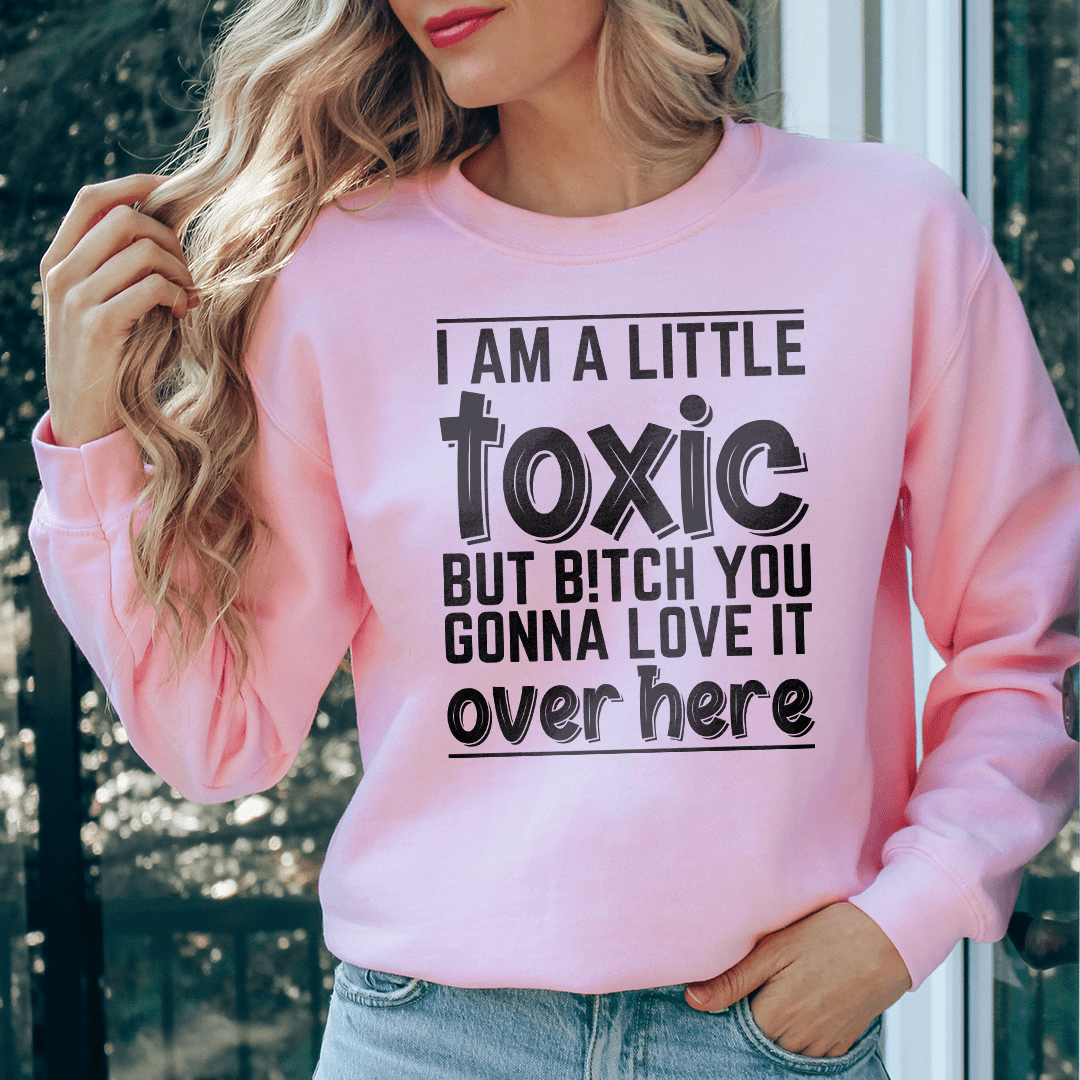 I Am A Little Toxic sweatshirt featuring a unique artistic design, made from a cozy cotton/poly fleece blend with adjustable cuffs.