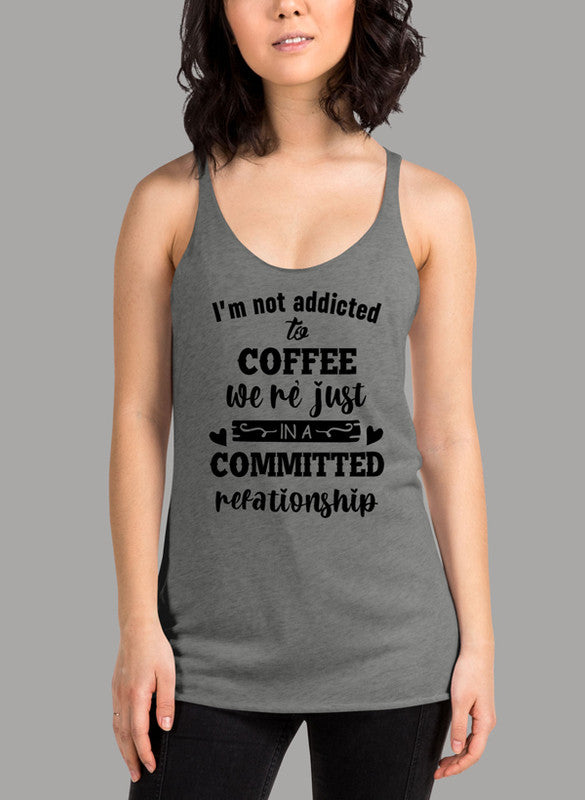 Black women's tank top with 'I Am Not Addicted To Coffee' printed design, featuring racer back style and curved hem.