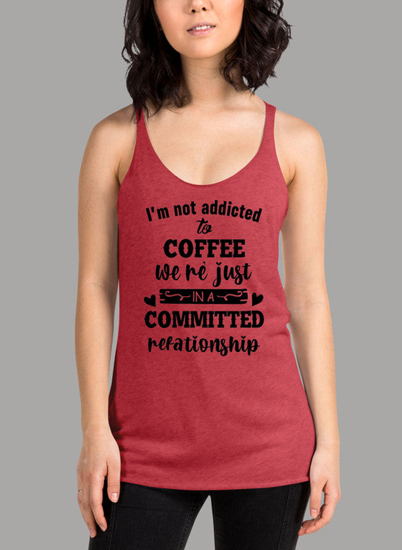 Black women's tank top with 'I Am Not Addicted To Coffee' printed design, featuring racer back style and curved hem.