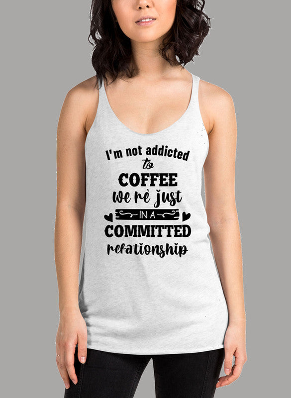 Black women's tank top with 'I Am Not Addicted To Coffee' printed design, featuring racer back style and curved hem.