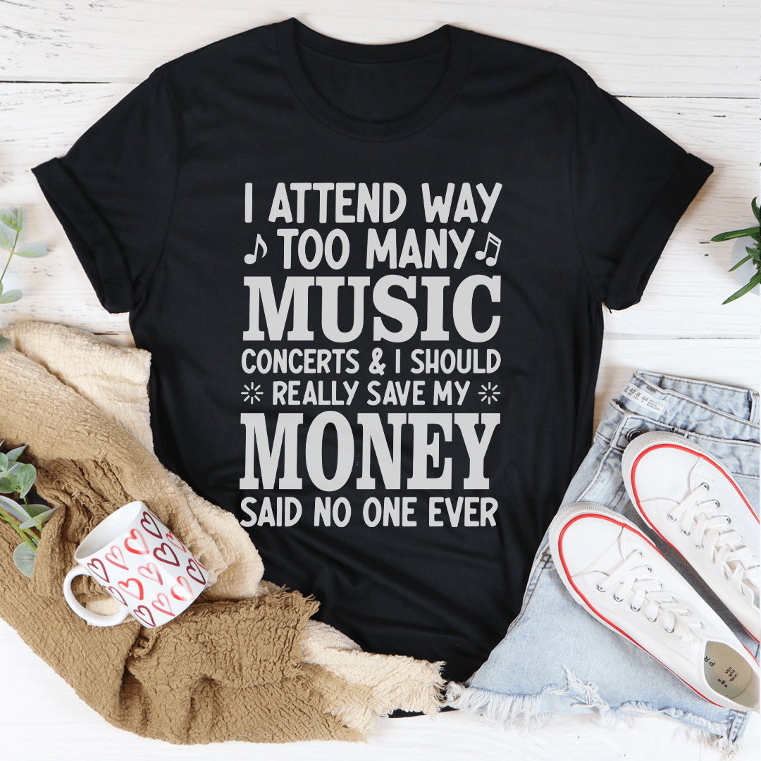 A stylish black t-shirt featuring the phrase 'I Attend Way Too Many Music Concerts' printed in vibrant colors, showcasing a love for music.