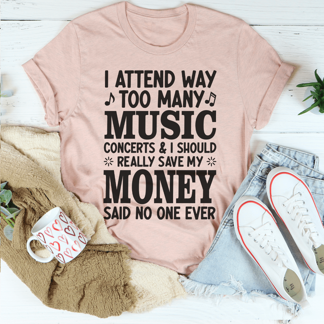 A stylish black t-shirt featuring the phrase 'I Attend Way Too Many Music Concerts' printed in vibrant colors, showcasing a love for music.