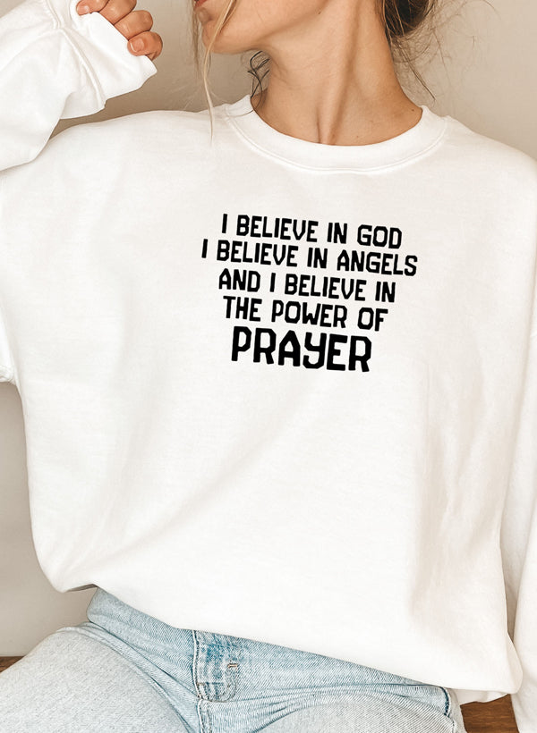 A cozy hoodie featuring the phrase 'I Believe In God I Believe In Angels' designed for comfort and style.