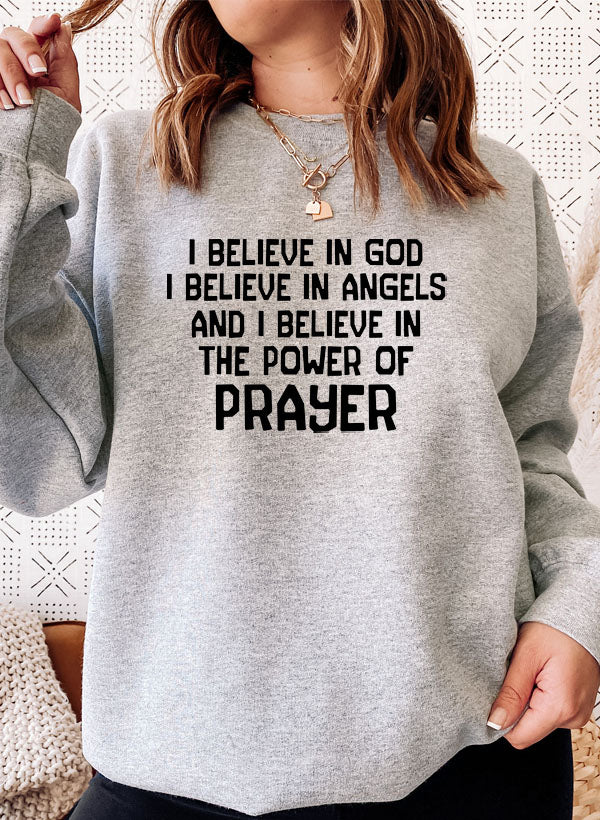 A cozy hoodie featuring the phrase 'I Believe In God I Believe In Angels' designed for comfort and style.