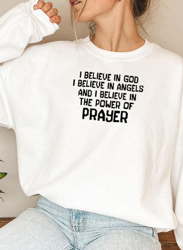 A cozy hoodie featuring the phrase 'I Believe In God I Believe In Angels' designed for comfort and style.