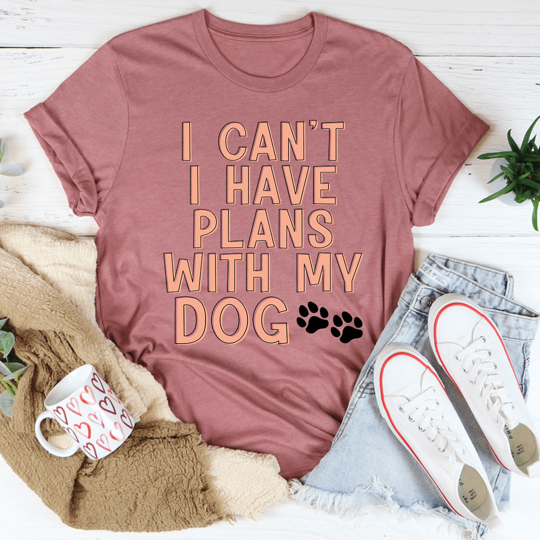 A stylish I Can't I Have Plans With My Dog Tee made from soft cotton, featuring a playful dog-themed slogan.