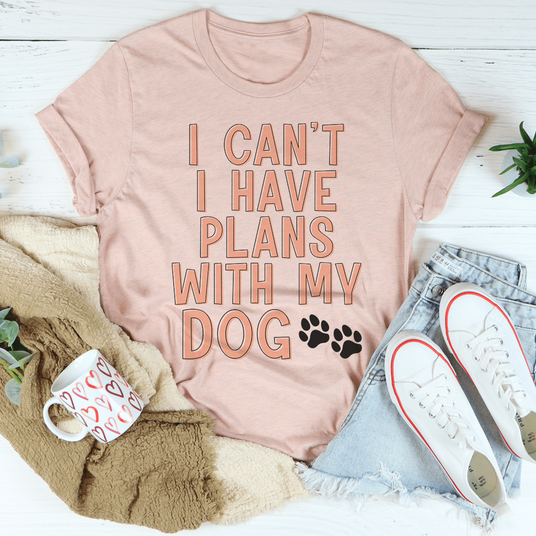 A stylish I Can't I Have Plans With My Dog Tee made from soft cotton, featuring a playful dog-themed slogan.