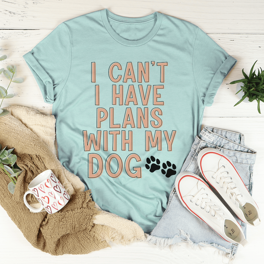 A stylish I Can't I Have Plans With My Dog Tee made from soft cotton, featuring a playful dog-themed slogan.