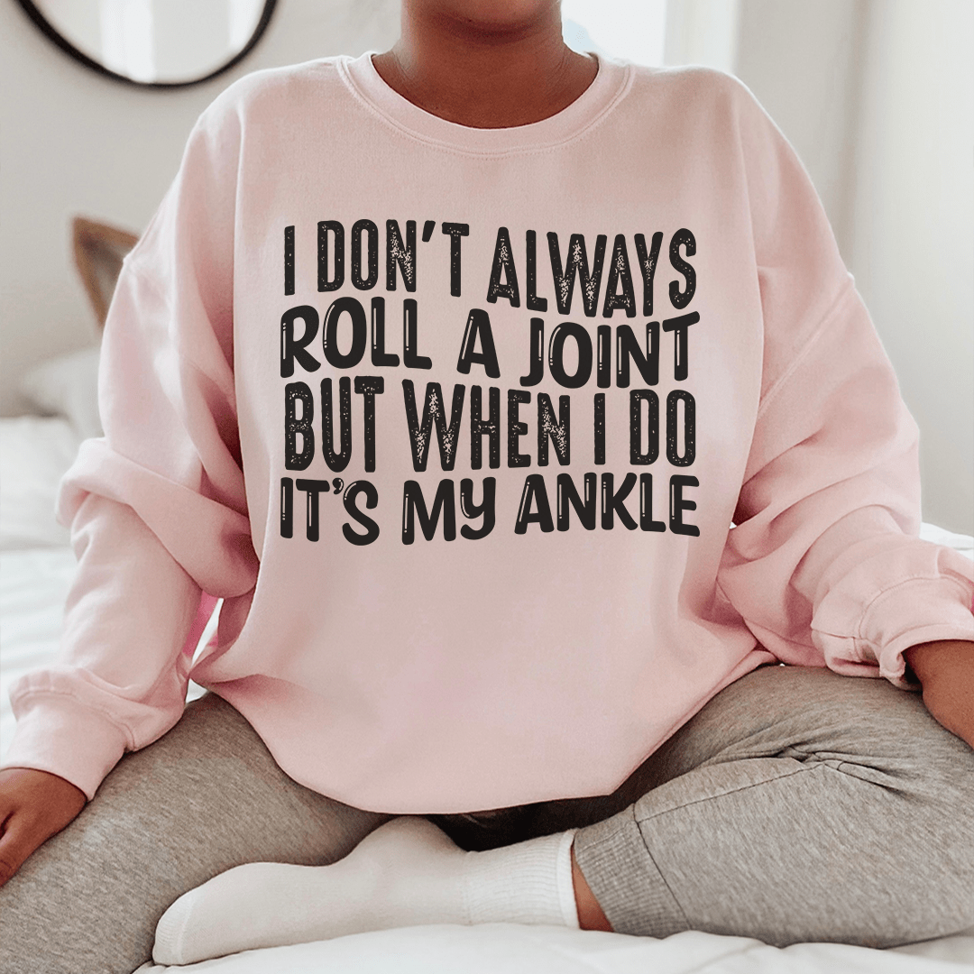 A cozy hoodie featuring the humorous phrase 'I Don't Always Roll A Joint But When I Do It's My Ankle', made from soft cotton/poly fleece blend.