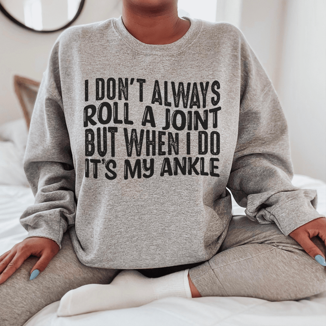 A cozy hoodie featuring the humorous phrase 'I Don't Always Roll A Joint But When I Do It's My Ankle', made from soft cotton/poly fleece blend.