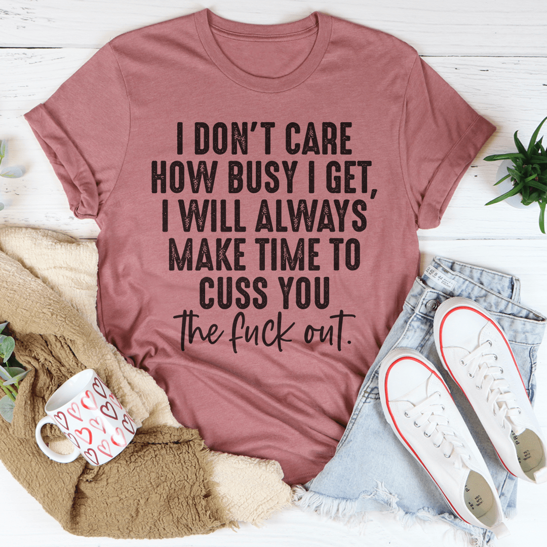 A stylish black t-shirt featuring the phrase 'I Don't Care How Busy I Get' printed in bold letters, showcasing its soft fabric and durable stitching.