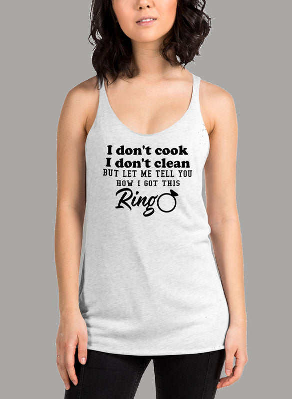 Black women's tank top with 'I Don't Cook, I Don't Clean' text, featuring a racer back style and curved hem.