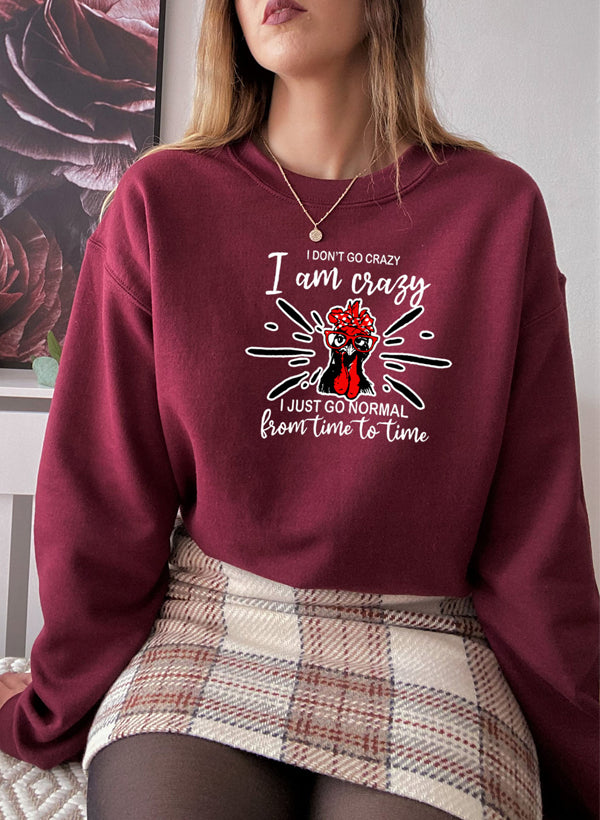 A cozy cotton/poly fleece sweatshirt featuring the phrase 'I Don't Go Crazy, I Am Crazy, I Just Go Normal From Time To Time' in a stylish design.