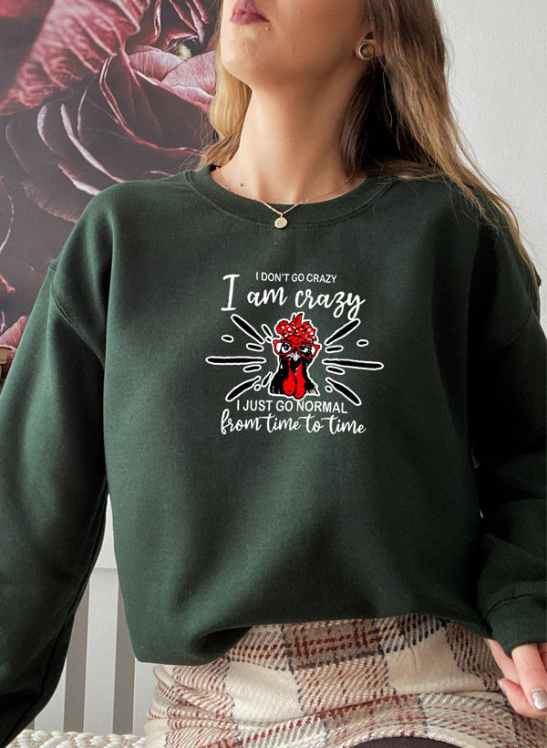 A cozy cotton/poly fleece sweatshirt featuring the phrase 'I Don't Go Crazy, I Am Crazy, I Just Go Normal From Time To Time' in a stylish design.