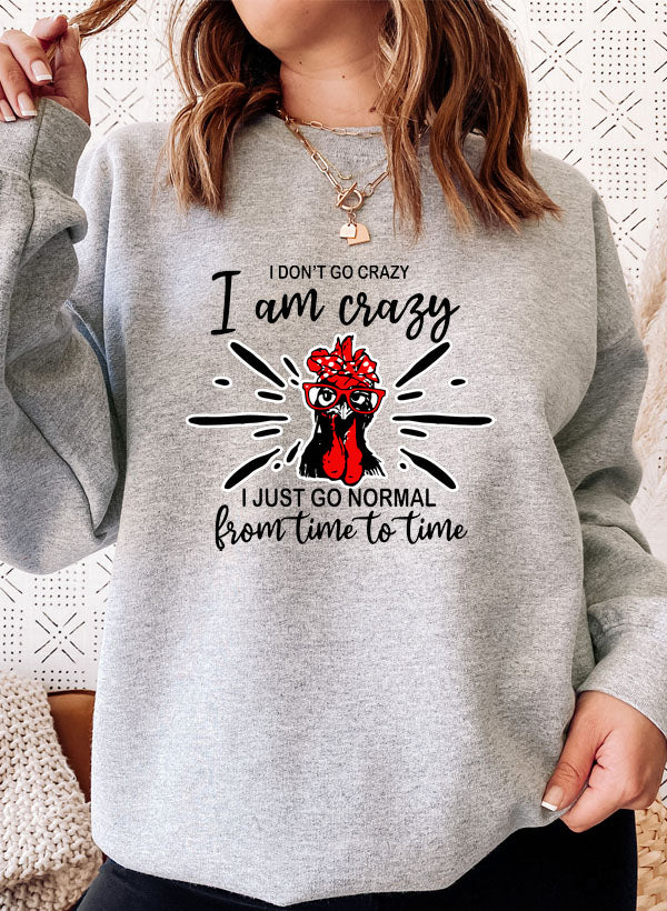 A cozy cotton/poly fleece sweatshirt featuring the phrase 'I Don't Go Crazy, I Am Crazy, I Just Go Normal From Time To Time' in a stylish design.