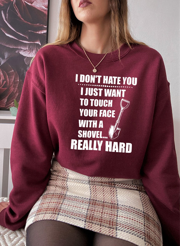 I Don't Hate You Sweat Shirt featuring a unique artistic design, cozy fleece lining, and adjustable cuffs for a perfect fit.