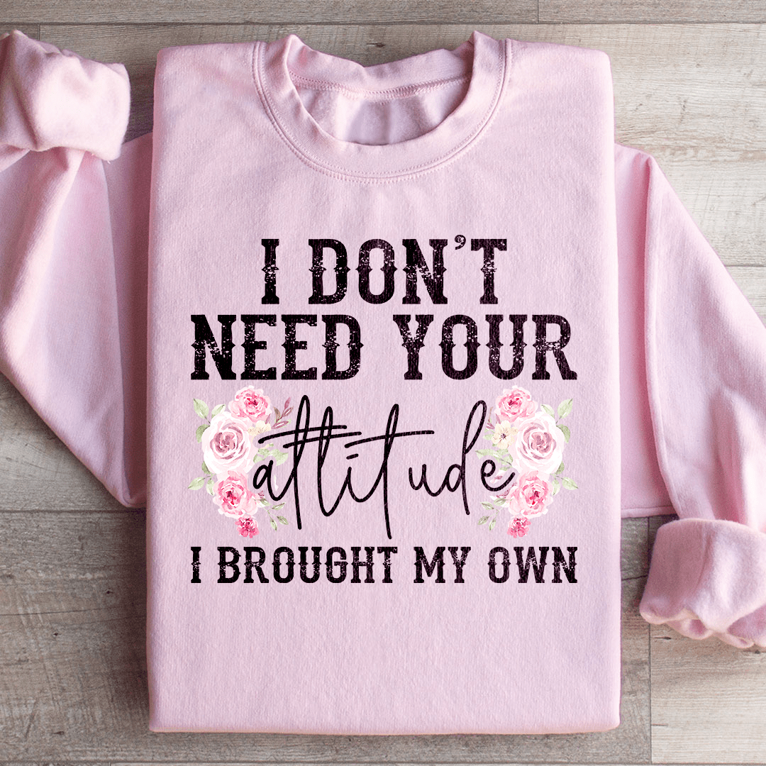 A cozy hoodie featuring the phrase 'I Don't Need Your Attitude I Brought My Own', designed by top artists, showcasing a stylish and comfortable fit.