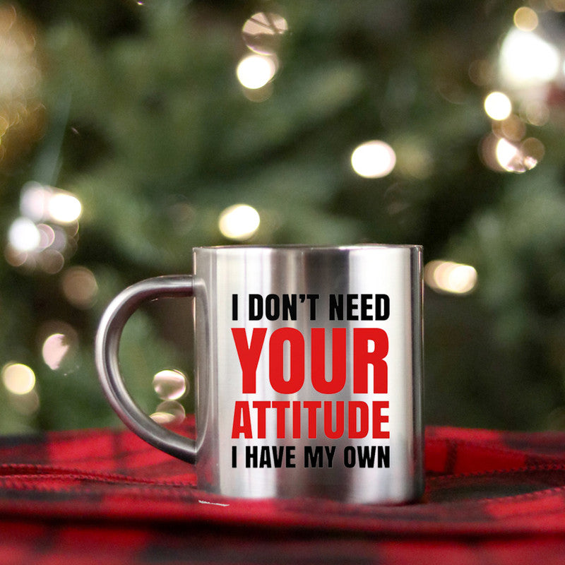 Ceramic gold and silver mug with humorous text, showcasing a stylish design.