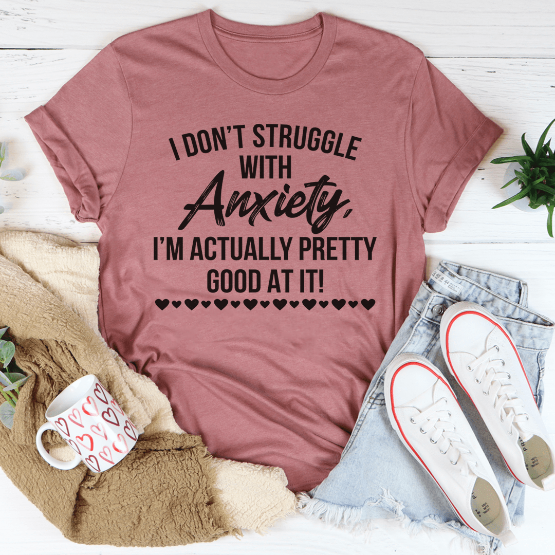 A comfortable I Don't Struggle With Anxiety Tee made from soft ring-spun cotton, featuring double stitching for durability and a meaningful printed message.