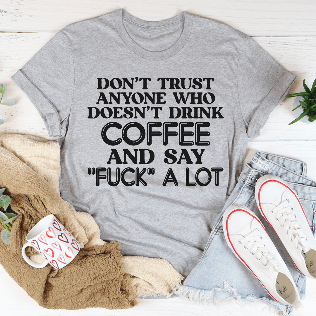 A stylish black t-shirt with the phrase 'I Don't Trust Anyone' printed on it, showcasing its soft fabric and double-stitched neckline.