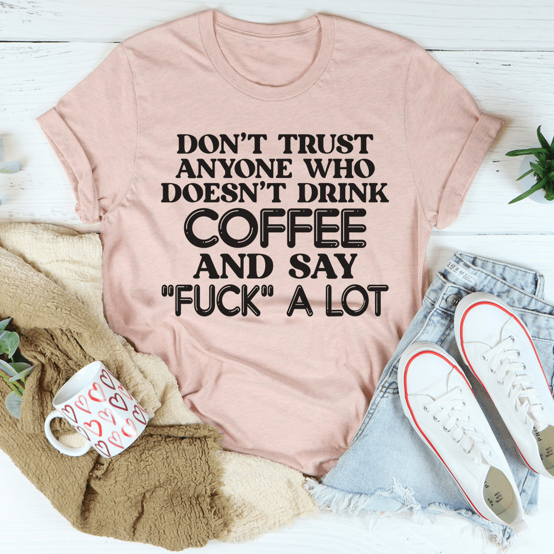 A stylish black t-shirt with the phrase 'I Don't Trust Anyone' printed on it, showcasing its soft fabric and double-stitched neckline.