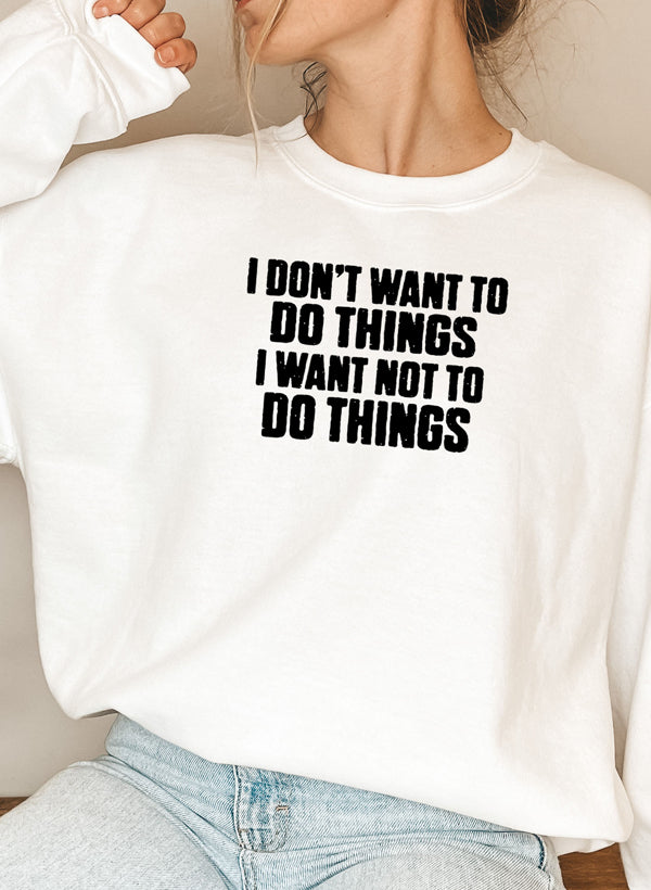 A cozy 'I Don't Want To Do Things' Sweat Shirt featuring a unique artistic design, made from a soft cotton/poly fleece blend.