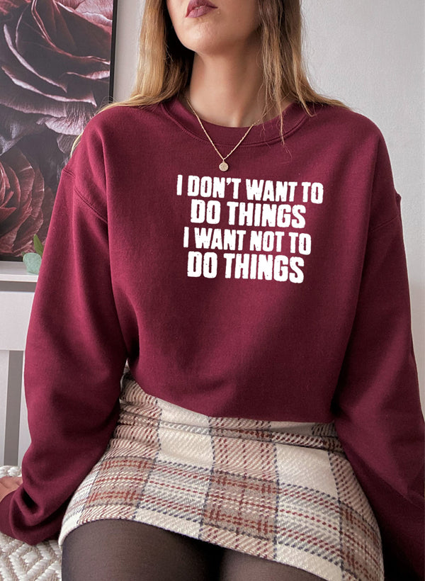 A cozy 'I Don't Want To Do Things' Sweat Shirt featuring a unique artistic design, made from a soft cotton/poly fleece blend.