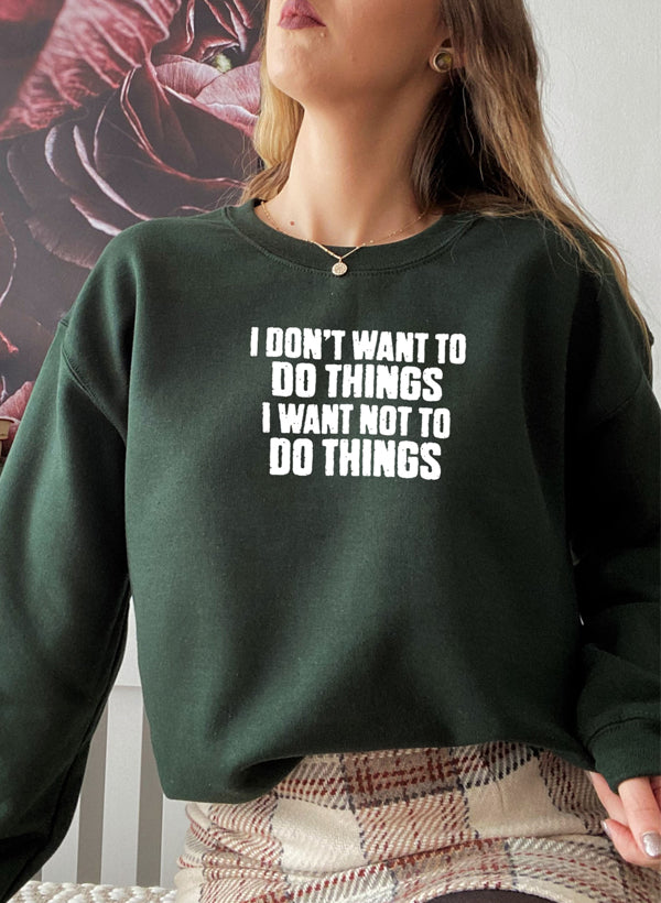 A cozy 'I Don't Want To Do Things' Sweat Shirt featuring a unique artistic design, made from a soft cotton/poly fleece blend.