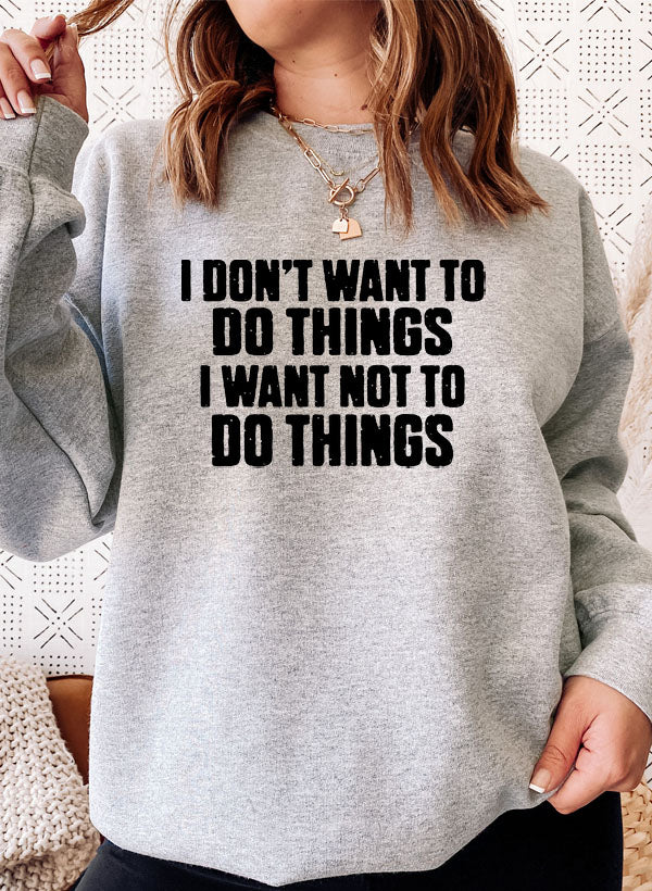 A cozy 'I Don't Want To Do Things' Sweat Shirt featuring a unique artistic design, made from a soft cotton/poly fleece blend.