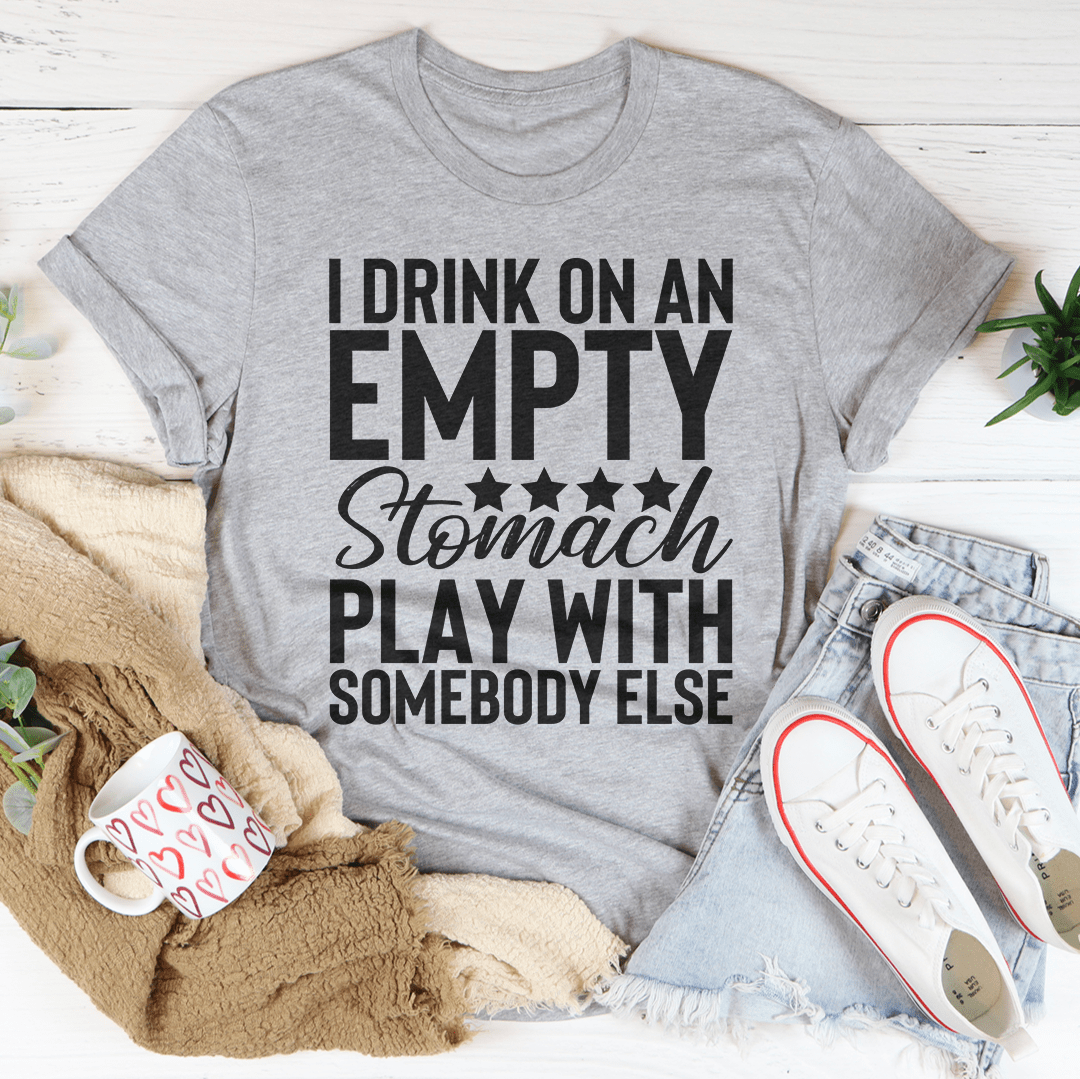 I Drink On An Empty Stomach Tee, a comfortable and durable t-shirt made from soft ring-spun cotton, featuring double stitching for added durability.