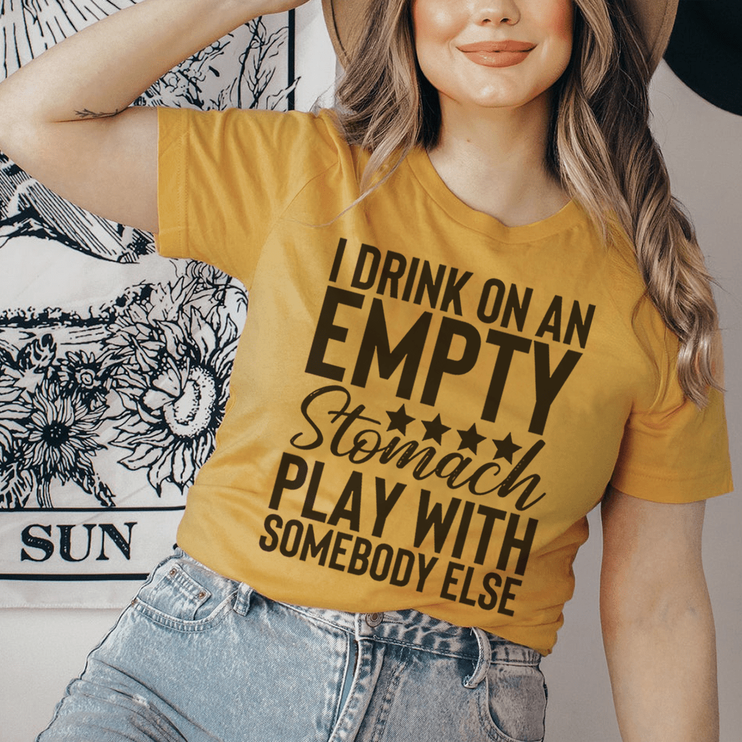 I Drink On An Empty Stomach Tee, a comfortable and durable t-shirt made from soft ring-spun cotton, featuring double stitching for added durability.