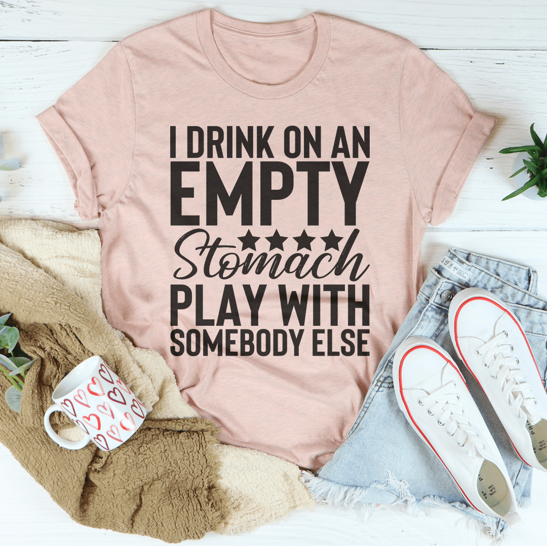 I Drink On An Empty Stomach Tee, a comfortable and durable t-shirt made from soft ring-spun cotton, featuring double stitching for added durability.