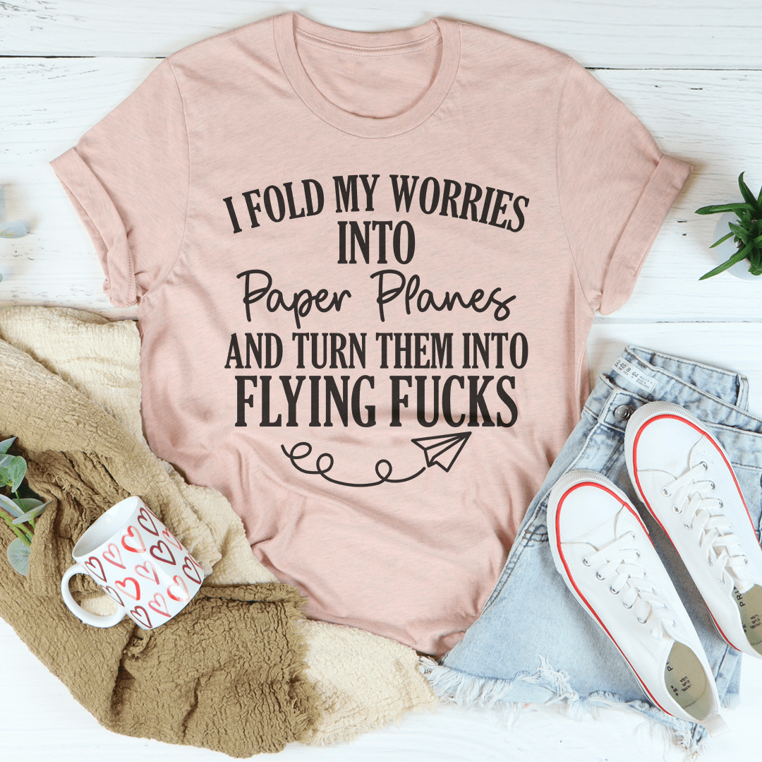 A stylish I Fold My Worries Into Paper Planes And Turn Them Into Flying F Tee made from soft ring-spun cotton, featuring double stitching for durability.