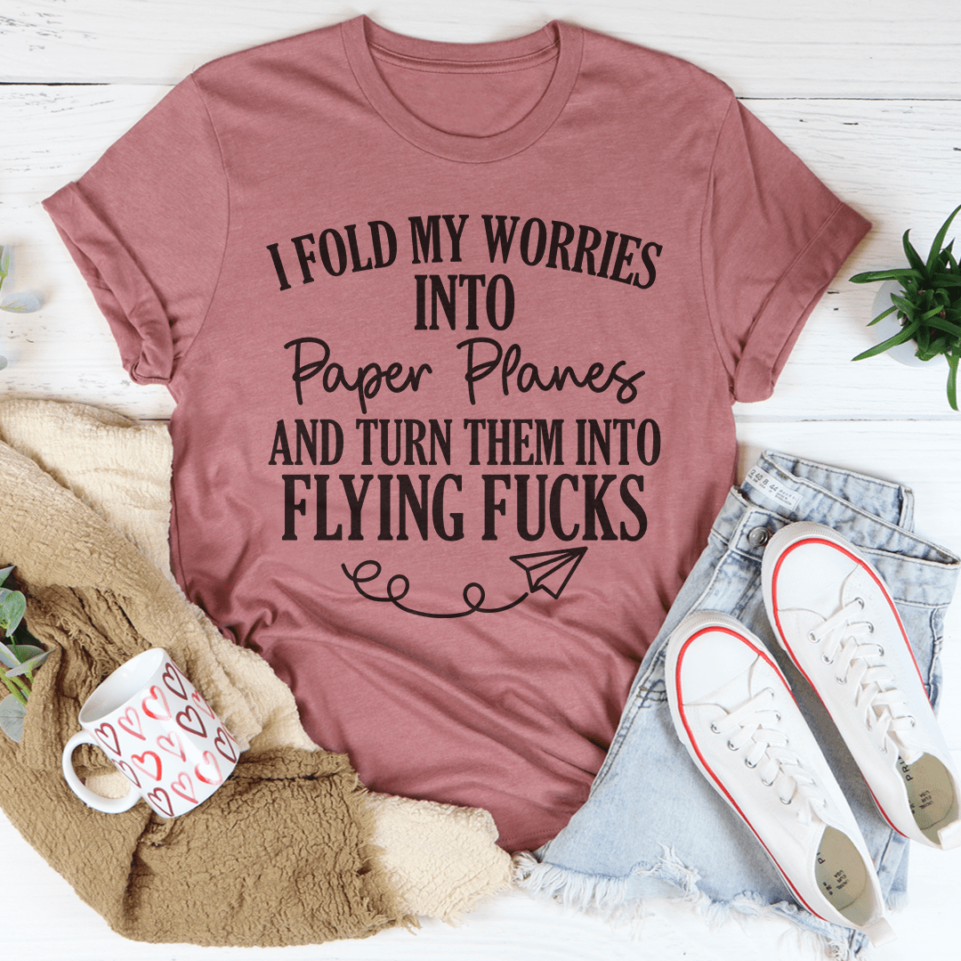 A stylish I Fold My Worries Into Paper Planes And Turn Them Into Flying F Tee made from soft ring-spun cotton, featuring double stitching for durability.